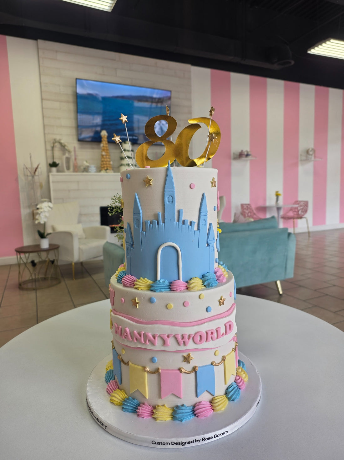 Colorful two-tier birthday cake made by Rose Cake Louisville
